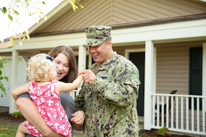 Air Force member hugging his wife